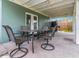 Relaxing patio area with seating and table at 206 N Himes Ave, Tampa, FL 33609