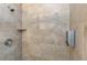Shower with beige tiles and built-in shelf at 206 N Himes Ave, Tampa, FL 33609