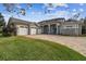 Beautiful two-story house featuring a three-car garage and a large backyard at 2315 Dovewood Estates Ct, Valrico, FL 33594