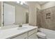 Simple bathroom with single vanity, shower/tub combo, and neutral tile at 2416 Wise River Ln, Zephyrhills, FL 33541