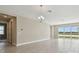 Spacious dining room with large windows and tile floors at 2416 Wise River Ln, Zephyrhills, FL 33541