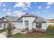 Single-story home with gray tile roof and stone accents at 2416 Wise River Ln, Zephyrhills, FL 33541