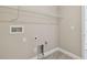 Convenient laundry room with shelving and hookups at 2416 Wise River Ln, Zephyrhills, FL 33541