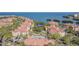Aerial view showcasing community, waterfront, and resort-style pool at 2724 Via Murano # 631, Clearwater, FL 33764