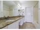 Bathroom with granite double vanity and tiled floors at 2724 Via Murano # 631, Clearwater, FL 33764