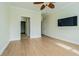 Bedroom with wood floors, ceiling fan, and large closet at 2724 Via Murano # 631, Clearwater, FL 33764