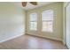 Bright bedroom with wood flooring and two windows at 2724 Via Murano # 631, Clearwater, FL 33764