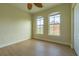 Bright bedroom with wood floors and two large windows at 2724 Via Murano # 631, Clearwater, FL 33764