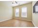 Bedroom with wood floors, ceiling fan, and arched windows at 2724 Via Murano # 631, Clearwater, FL 33764