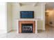 Living room fireplace with a granite mantel at 2724 Via Murano # 631, Clearwater, FL 33764