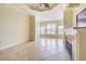 Large living room featuring a fireplace and large windows at 2724 Via Murano # 631, Clearwater, FL 33764