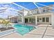 Two-story home with covered patio, pool, and spa at 28475 Marsciano Ln, Wesley Chapel, FL 33543