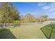 Large grassy backyard with privacy fence at 28475 Marsciano Ln, Wesley Chapel, FL 33543
