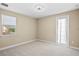 Bedroom with a door leading to outside at 28475 Marsciano Ln, Wesley Chapel, FL 33543