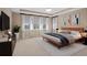 Spacious main bedroom with large windows and stylish decor at 28475 Marsciano Ln, Wesley Chapel, FL 33543