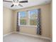 Bright bedroom with neutral walls, carpet, and window treatments at 28475 Marsciano Ln, Wesley Chapel, FL 33543