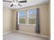 Bright bedroom with neutral decor and window coverings at 28475 Marsciano Ln, Wesley Chapel, FL 33543