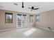 Versatile bonus room with balcony access and neutral decor at 28475 Marsciano Ln, Wesley Chapel, FL 33543