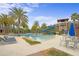Resort-style pool with a waterslide, lounge chairs, and shaded seating areas at 28475 Marsciano Ln, Wesley Chapel, FL 33543