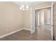 Dining room with tile floor and french doors to entryway at 28475 Marsciano Ln, Wesley Chapel, FL 33543