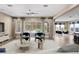 Gathering room with pool view, modern furniture, and stylish decor at 28475 Marsciano Ln, Wesley Chapel, FL 33543
