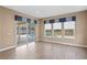 Bright Gathering room with pool view and sliding glass doors at 28475 Marsciano Ln, Wesley Chapel, FL 33543