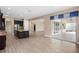 Open concept kitchen with island and stainless steel appliances at 28475 Marsciano Ln, Wesley Chapel, FL 33543