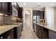 Modern kitchen with granite countertops and stainless steel appliances at 28475 Marsciano Ln, Wesley Chapel, FL 33543
