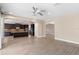 Open concept living room and kitchen with tile flooring at 28475 Marsciano Ln, Wesley Chapel, FL 33543