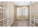 Home office with neutral decor, tile flooring, and chandelier at 28475 Marsciano Ln, Wesley Chapel, FL 33543