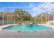 Inviting screened pool and spa with tiled accents at 28475 Marsciano Ln, Wesley Chapel, FL 33543