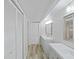 Clean bathroom with modern vanity and flooring at 2866 Countrybrook Dr # 15, Palm Harbor, FL 34684