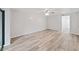 Bedroom with wood-look floors and ceiling fan at 2866 Countrybrook Dr # 15, Palm Harbor, FL 34684