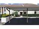 Condo carport with parking spaces and landscaping at 2866 Countrybrook Dr # 15, Palm Harbor, FL 34684