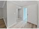 Bright entryway with wood-look flooring and updated interior doors at 2866 Countrybrook Dr # 15, Palm Harbor, FL 34684