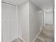 Clean hallway with light grey walls and wood-look floors at 2866 Countrybrook Dr # 15, Palm Harbor, FL 34684