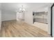 Open living room and kitchen with wood-look floors at 2866 Countrybrook Dr # 15, Palm Harbor, FL 34684
