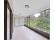 Relaxing screened porch overlooking a lush garden at 2866 Countrybrook Dr # 15, Palm Harbor, FL 34684