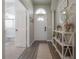 Inviting entryway with white console table and wood-look floors at 2909 Folklore Dr, Valrico, FL 33596