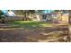 Large backyard with grassy area and wooden fence at 301 3Rd Sw Ave, Largo, FL 33770