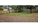Fenced backyard with mature trees at 301 3Rd Sw Ave, Largo, FL 33770