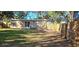 Backyard with grassy area, wooden fence, and gated access at 301 3Rd Sw Ave, Largo, FL 33770