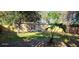 Spacious backyard with grassy area and wooden fence at 301 3Rd Sw Ave, Largo, FL 33770