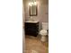 Bathroom features vanity, toilet, and tiled floor at 301 3Rd Sw Ave, Largo, FL 33770