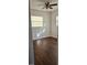 Bright bedroom with wood-look floors and ceiling fan at 301 3Rd Sw Ave, Largo, FL 33770