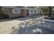 Newly renovated home with a small, well-manicured front yard at 301 3Rd Sw Ave, Largo, FL 33770