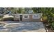 Charming single story home with a gravel driveway at 301 3Rd Sw Ave, Largo, FL 33770