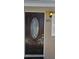 Elegant dark brown front door with glass details at 301 3Rd Sw Ave, Largo, FL 33770