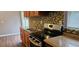 Kitchen features stainless steel range and wood cabinets at 301 3Rd Sw Ave, Largo, FL 33770