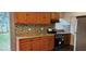 Bright kitchen with wood cabinets and stainless steel appliances at 301 3Rd Sw Ave, Largo, FL 33770